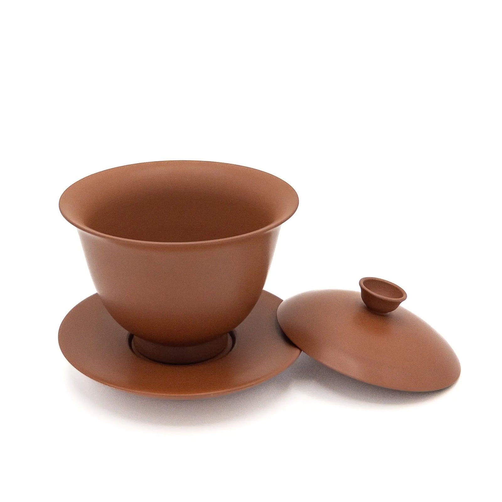 Red/brown gaiwan with lid off on a white background
