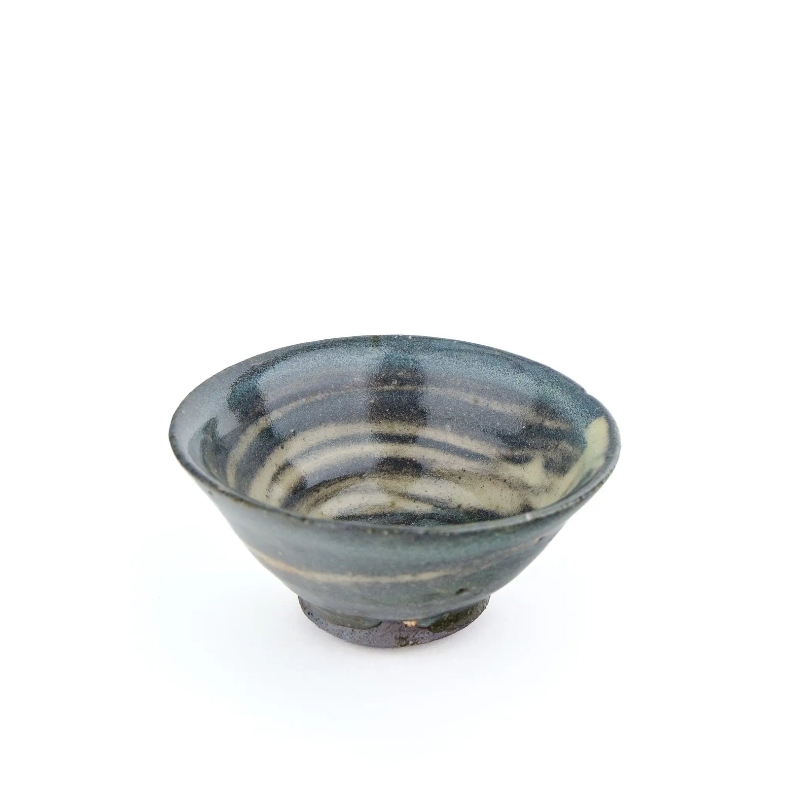 A handmade ceramic gong fu teacuip with a textured, speckled glaze - inside view