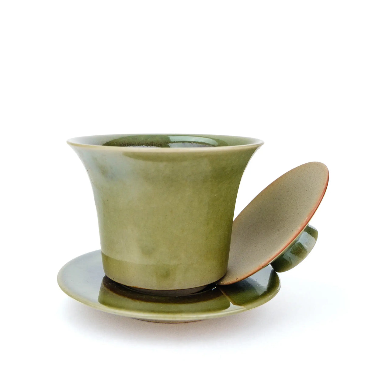 Handmade gaiwan with a green glaze.  Photo shows the lid off the bowl. 