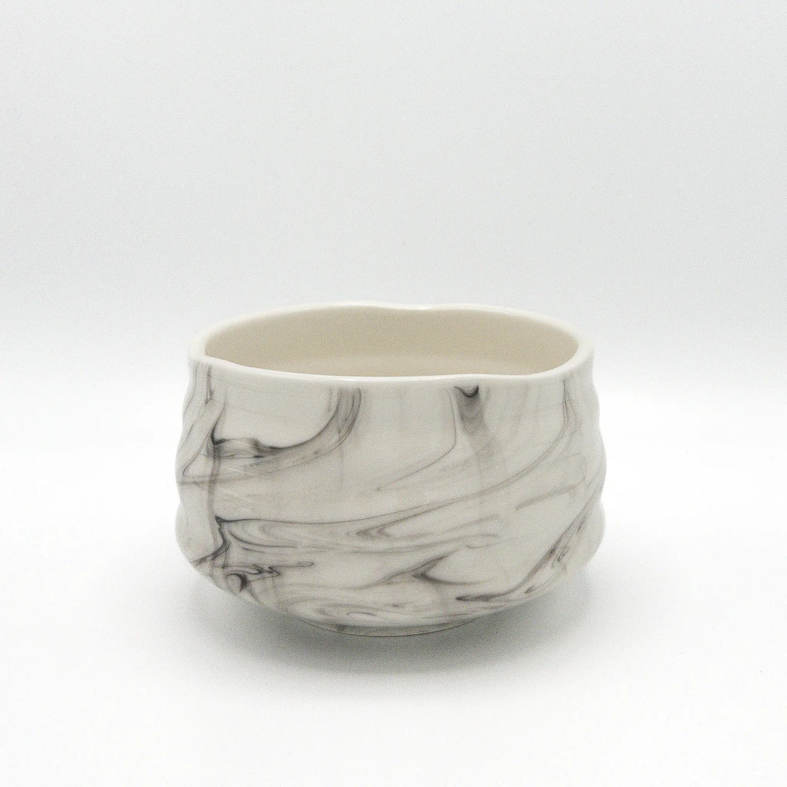 Marbled ceramic bowl on a white background