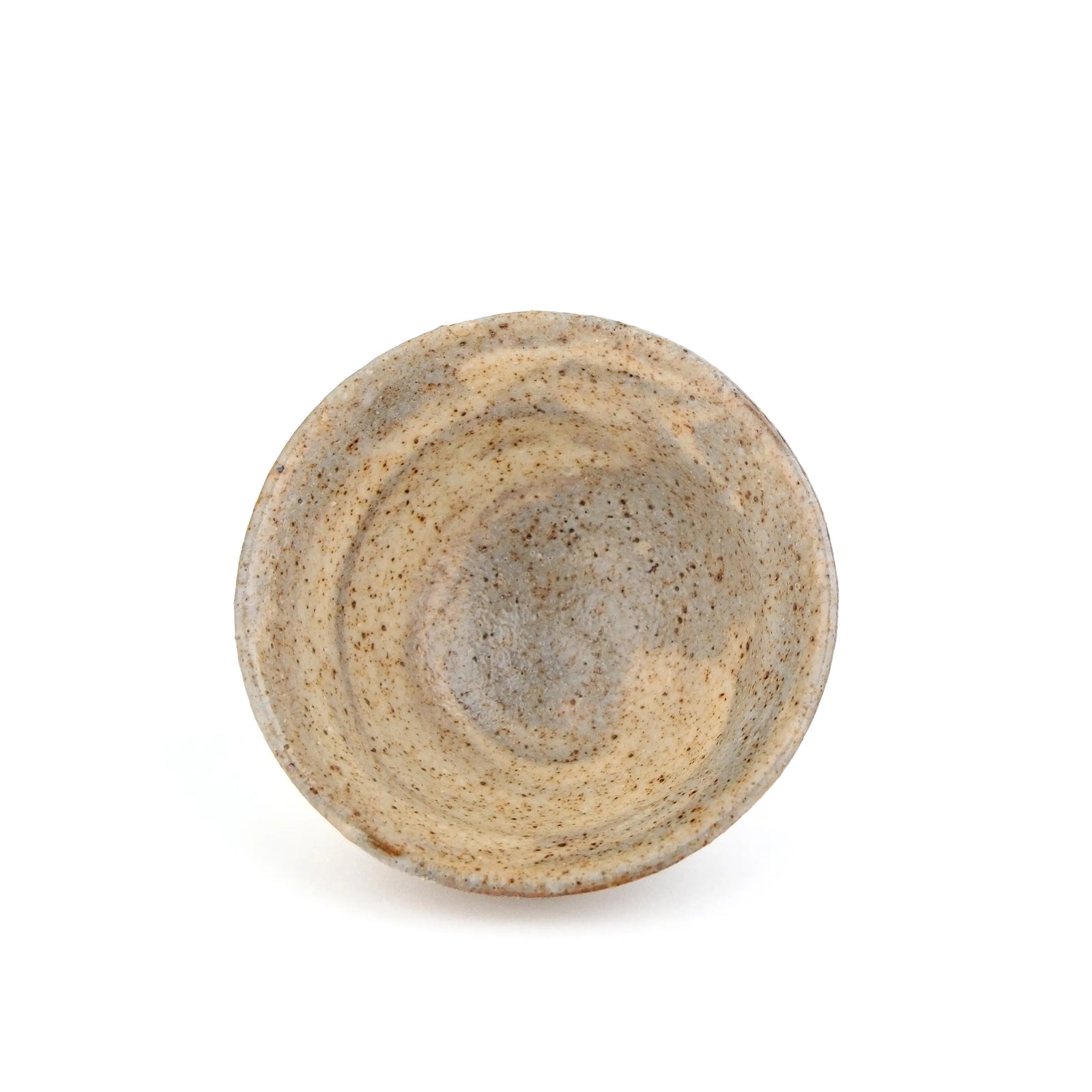 A handmade ceramic gong fu teacup with a textured, speckled glaze in earthy beige and brown tones, set against a plain white background - inside the cup view