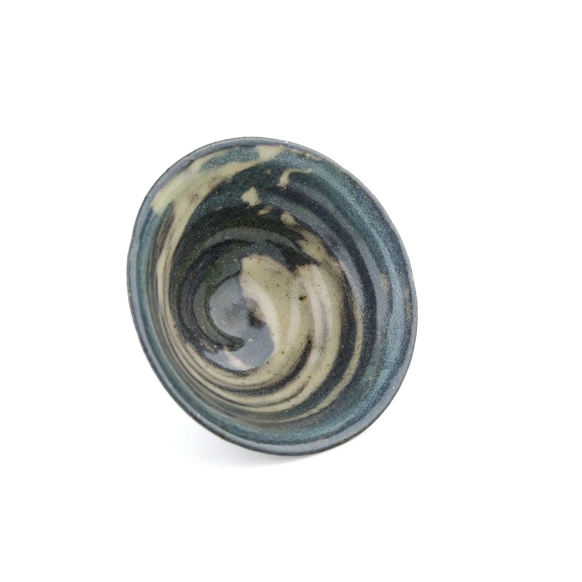A handmade ceramic gong fu teacuip with a textured, speckled glaze - inside view of cup