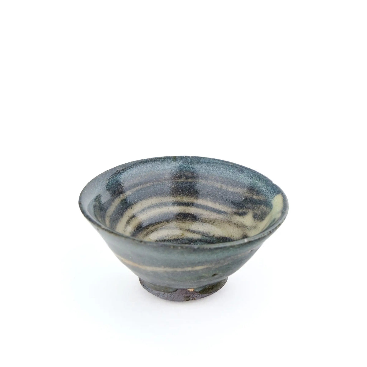 A handmade ceramic gong fu teacuip with a textured, speckled glaze - inside view