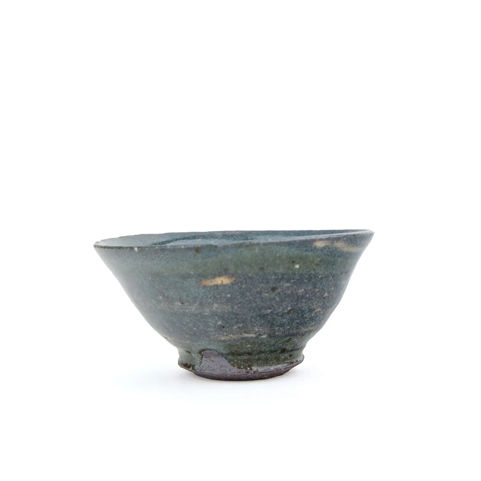 A handmade ceramic gong fu teacuip with a textured, speckled glaze - view from the side