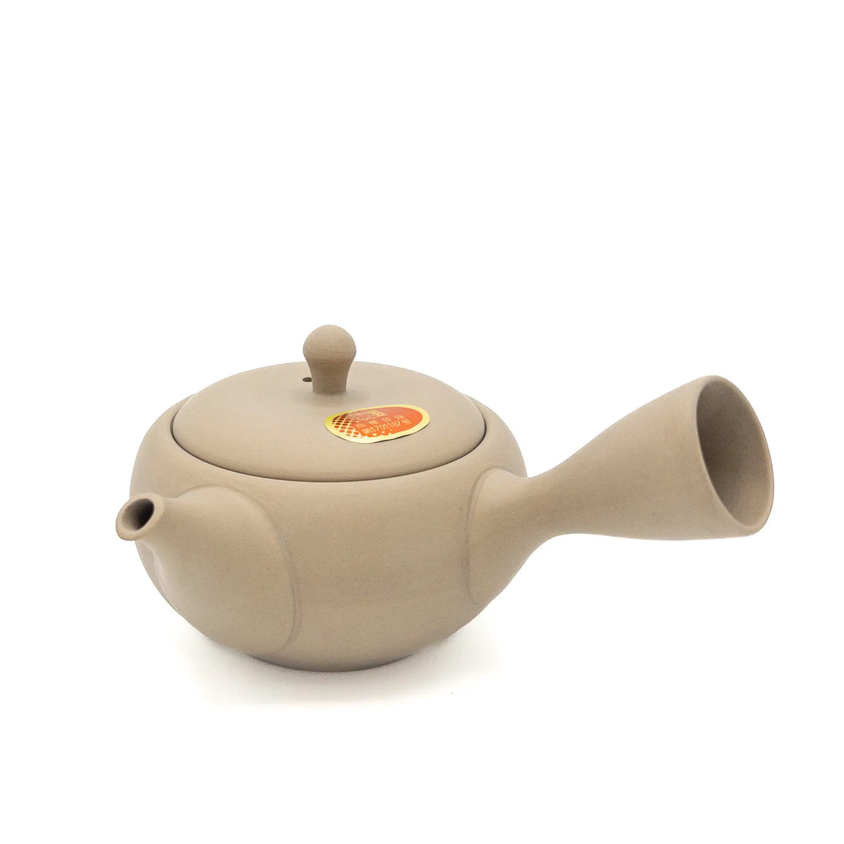 Beige Japanese teapot on a white background